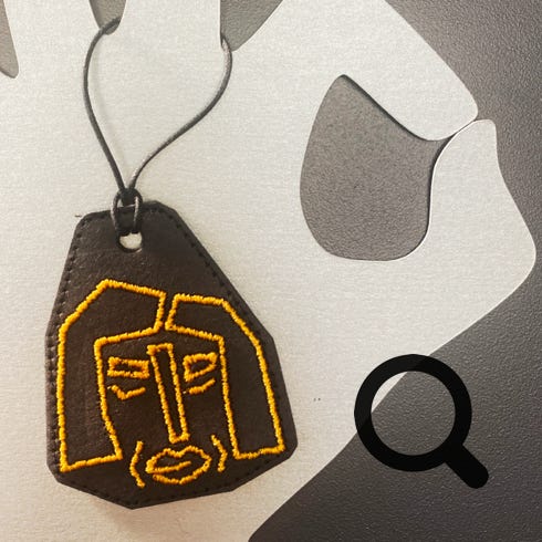 SnapPap Anhänger Xore Schwarz-Gold bestickt 